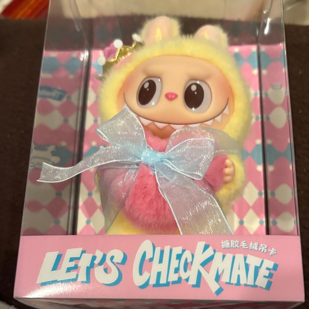 Cute Yellow and Pink Figurine with Bow